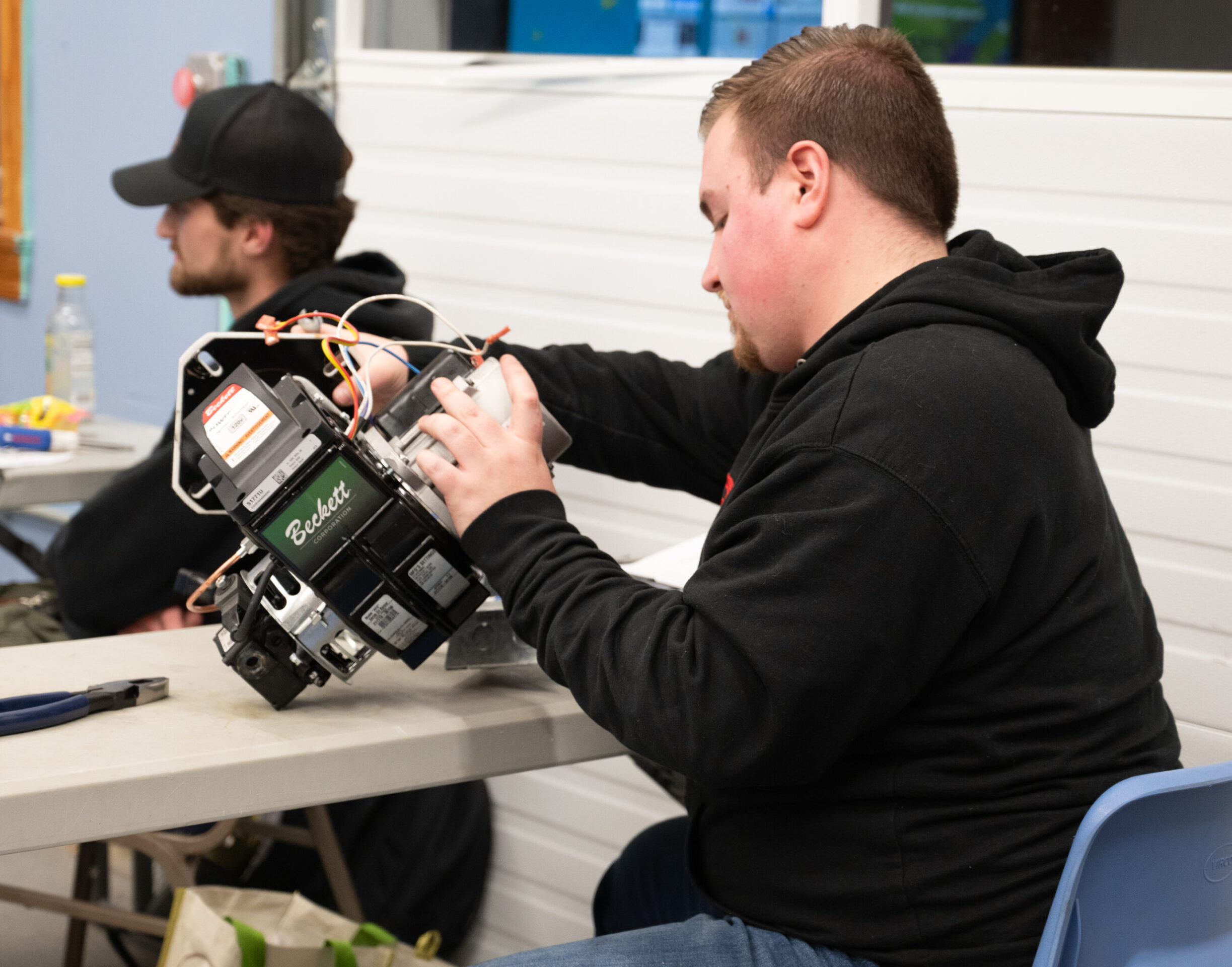 Student working on Air Conditioning component